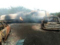 The scene of a gasoline tanker explosion on a highway in Kogi, Nigeria, Thursday Nov. 10, 2022. At least 12 people were killed when a gasoline tanker crashed on a major road and then exploded in Nigeria’s north central Kogi State, police said Friday. (AP Photo/Odogun Samuel Olugbenga)