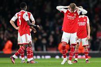 Arsenal's Norwegian midfielder Martin Odegaard (2R) and teammates react after a penalty shoot-out in the UEFA Europa League round of 16, second-leg football match between Arsenal and Sporting Lisbon at the Emirates Stadium in London on March 16, 2023. - Sporting Lisbon won the match 5-3 on penalties. (Photo by Glyn KIRK / AFP) (Photo by GLYN KIRK/AFP via Getty Images)