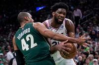 Boston Celtics center Al Horford (42) tries to stop Philadelphia 76ers center Joel Embiid during the first half of Game 5 in an NBA basketball Eastern Conference semifinal playoff series Tuesday, May 9, 2023, in Boston. (AP Photo/Charles Krupa)