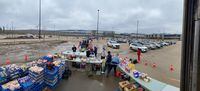Residents affected by flooding line up as the Wood Buffalo Food Bank Association gives away produce donated by Superstore in Fort McMurray, Alta., on Saturday, May 2, 2020. THE CANADIAN PRESS/Wood Buffalo Food Bank Association, Dan Edwards