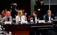 Canadian National Soccer Team players Sophie Schmidt, left Janine Beckie, Christine Sinclair, and Quinn, right, prepare to appear before the Standing Committee on Canadian Heritage in Ottawa, studying safe sport in Canada, on Thursday, March 9, 2023. THE CANADIAN PRESS/Justin Tang