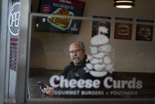 Bill Pratt, a veteran chef and CEO of Chef Inspired soup of Restaurants, poses at one of his restaurants, Cheese Curds Gourmet Burgers + Poutinerie in Dartmouth, N.S. on Wednesday, May 17, 2023. THE CANADIAN PRESS/Darren Calabrese