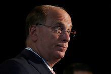 FILE PHOTO: Larry Fink, Chief Executive Officer of BlackRock, stands at the Bloomberg Global Business forum in New York, U.S., September 26, 2018. REUTERS/Shannon Stapleton/File Photo