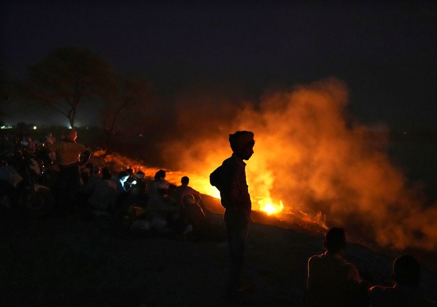 Indians watch funeral pyres burn in Uttar Pradesh state