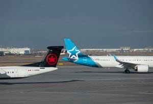 An Air Transat jet passes behind an Air Canada craft at the Montréal-Trudeau International Airport on Mar 3, 2024. (Fred Lum/The Globe and Mail)