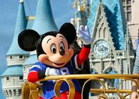 FILE - In this Feb. 4, 2019, file photo, Mickey Mouse celebrates the Super Bowl winning team, the New England Patriots, during the Super Bowl victory parade in the Magic Kingdom at Walt Disney World in Lake Buena Vista, Fla. Months after workers who play Mickey Mouse and Goofy at Walt Disney World threatened to leave the Teamsters union because of what they called "horrible misrepresentation," General President James Hoffa has appointed two associates to take over the local union in Orlando, Fla., according to a letter from Hoffa posted Monday, June 24, to the doors of the Local 385 union hall. (Joe Burbank/Orlando Sentinel via AP, File)