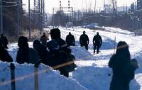 Police surround protestors at a rail blockade in Saint-Lambert, Que. on Friday, February 21, 2020. The protesters are blocking the line in solidarity with the Wet'suwet'en hereditary chiefs opposed to the LNG pipeline in northern British Columbia. THE CANADIAN PRESS/Paul Chiasson