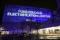 A projection on the facade of the Ford Motor Company's headquarters reads 'Ford Cologne - Electrification Centre' following the company's announcement to build future electric cars in Cologne, Germany, February 17, 2021. Oliver Berg/Pool via REUTERS