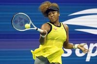 Naomi Osaka, of Japan, returns a shot to Marie Bouzkova, of the Czech Republic, during the first round of the US Open tennis championships, Monday, Aug. 30, 2021, in New York. (AP Photo/Elise Amendola)