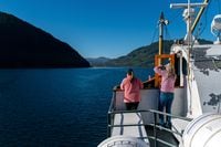 Passengers take in the view of the Alberni Inlet as the M.V. Frances Barkley sails out on her way to Bamfield on the Western edge of Vancouver Island on Thursday, June 23, 2022. Photographer: James MacDonald