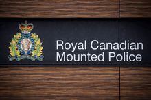 The RCMP logo is seen outside Royal Canadian Mounted Police "E" Division Headquarters, in Surrey, B.C., on Friday April 13, 2018. Traffic is back to normal through central Kelowna after RCMP detonated a confirmed explosive device found near a busy route in that Okanagan city. THE CANADIAN PRESS/Darryl Dyck