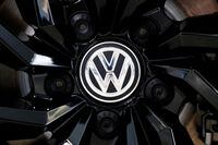 FILE PHOTO: The logo of German carmaker Volkswagen is seen on a rim cap in a showroom of a Volkswagen car dealer in Brussels, Belgium July 9, 2020. REUTERS/Francois Lenoir/File Photo