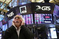 A trader reacts on the trading floor at the New York Stock Exchange (NYSE) in Manhattan, New York City, U.S., September 13, 2022. REUTERS/Andrew Kelly