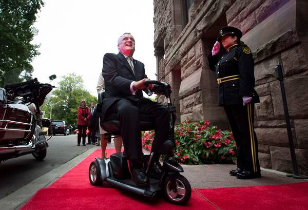 Outgoing Ontario Lieutenant-Governor David Onley is saluted while arriving for his last full day in office at Queen's Park in Toronto on Monday, September 22, 2014. A former Ontario lieutenant-governor tasked with reviewing the disability legislation says the province is nowhere near meeting its stated goal of full accessibility by 2025. THE CANADIAN PRESS/Darren Calabrese