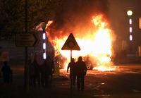 A car is set on fire at the Cloughfern roundabout in Newtownabbey, Belfast, Northern Ireland, on April 3, 2021.