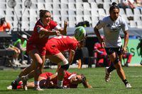 Canada's Chloe Daniels (L) passes the ball during the women's HSBC World Rugby Sevens Series 2023 quarter final match between New Zealand and Canada at the Cape Town stadium in Cape Town on December 10, 2023. (Photo by Rodger Bosch / AFP) (Photo by RODGER BOSCH/AFP via Getty Images)
