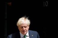 Britain's Prime Minister Boris Johnson walks to a waiting car as he leaves from 10 Downing Street in central London on July 13, 2022 to head to the Houses of Parliament for the weekly Prime Minister's Questions (PMQs) session. - Britain's ruling Conservative party was Wednesday to winnow down the eight candidates vying to succeed Prime Minister Boris Johnson amid growing acrimony over alleged dirty tricks. (Photo by CARLOS JASSO / AFP) (Photo by CARLOS JASSO/AFP via Getty Images)