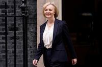 Britain's Prime Minister Liz Truss leaves 10 Downing Street to attend the weekly Prime Ministers' Questions session in parliament in London, Wednesday, Oct. 19, 2022. (AP Photo/Alberto Pezzali)