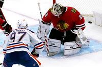 Chicago Blackhawks goaltender Alex Stalock, right, can't stop a goal by Edmonton Oilers center Connor McDavid during the third period of an NHL hockey game in Chicago, Thursday, Oct. 27, 2022. The Oilers won 6-5. (AP Photo/Nam Y. Huh)