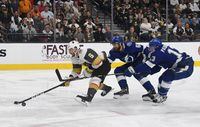 Colin Miller of the Vegas Golden Knights is tripped by Braydon Coburn  of the Tampa Bay Lightning as Cedric Paquette of the Lightning defends in the second period of their game at T-Mobile Arena on Oct. 26, 2018 in Las Vegas,.