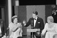 FILE - President Ronald Reagan and Queen Elizabeth II raise their glasses in a toast during a state dinner, March 3, 1983, at the M. H. de Young Museum in San Francisco's Golden Gate Park. Woman at right is unidentified. The FBI has disclosed a potential threat to the late Queen Elizabeth during her 1983 trip to the U.S. West Coast. The documents were released this last week of May, 2023, on the FBI’s records website. (AP Photo/Ed Reinke, File)