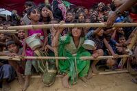 Rohingya Muslim children who crossed over from Myanmar into Bangladesh, wait squashed against each other to receive food handouts distributed to children and women by a Turkish aid agency at Thaingkhali refugee camp, Bangladesh, Saturday, Oct. 21, 2017. A new report has found that Facebook failed to detect blatant hate speech and calls to violence against Myanmar’s Rohingya Muslim minority years after such behavior was found to have played a determining role in the genocide against them. (AP Photo/Dar Yasin, File)