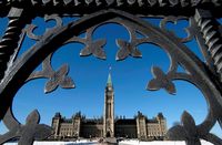 Centre Block is shown through the gates of Parliament Hill in Ottawa on Feb. 11, 2014. THE CANADIAN PRESS/Justin Tang