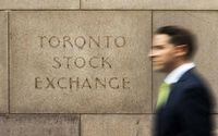 A man walks past an old Toronto Stock Exchange (TSX) sign in Toronto, June 23, 201