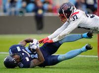 Toronto Argonauts wide receiver Kurleigh Gittens Jr. (19) catches a touchdown pass as Montreal Alouettes defensive back Wesley Sutton (37) defends during second half CFL Eastern Final football action in Toronto on Sunday, November 13, 2022. THE CANADIAN PRESS/Mark Blinch