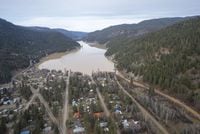 A swollen Otter Lake is pictured in Tulameen, B.C., Friday, Dec. 3, 2021. Officials in British Columbia are urging residents of communities at elevated risk of flooding to be prepared if water levels rise due to rapidly melting snow following too much rain. THE CANADIAN PRESS/Jonathan Hayward