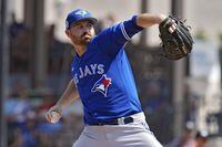 Toronto Blue Jays pitcher Drew Hutchison (36) delivers to the Detroit Tigers during the first inning of a spring training baseball game Saturday, March 4, 2023, in Lakeland, Fla. (AP Photo/Chris O'Meara)