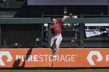Arizona Diamondbacks center fielder Daulton Varsho (12) catches a fly out hit by San Francisco Giants' Joey Bart during the fourth inning of a baseball game in San Francisco, Sunday, Oct. 2, 2022. The former Arizona Diamondback was sent to Toronto in exchange for outfielder Lourdes Gurriel Jr. and catcher Gabriel Moreno on Friday. THE CANADIAN PRESS/AP-Jeff Chiu