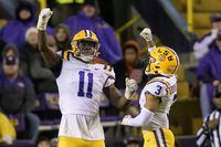 LSU defensive end Ali Gaye (11) celebrates a sack of UAB quarterback Dylan Hopkins with safety Greg Brooks Jr. (3) during the first half of an NCAA college football game in Baton Rouge, La., Saturday, Nov. 19, 2022. (AP Photo/Matthew Hinton)