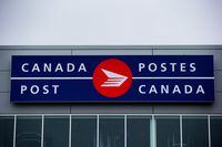 The Canada Post logo is seen on the outside the company's Pacific Processing Centre, in Richmond, B.C., on Thursday June 1, 2017.&nbsp;Canada Post says it is seeking "clarification" from the federal government about face masks after drawing criticism for refusing to let employees bring their own N95 masks to work.THE CANADIAN PRESS/Darryl Dyck