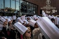 People wait to enter on the opening day of the international Gastronomy and Wine center in Dijon, Eastern France, on May 6, 2022. (Photo by JEFF PACHOUD / AFP) (Photo by JEFF PACHOUD/AFP via Getty Images)