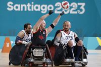 Zak Madell of Okotoks, Alta., scored 30 of his team's 46 tries as Canada surged into the wheelchair rugby semifinals at the 2023 Parapan Am Games with a 46-41 win over the archrival United States on Tuesday. Madell (33) passes the ball during wheelchair rugby mixed match 13 against the U.S.A., at the Santiago 2023 Parapan American Games, in Santiago, Chile, Tuesday, Nov. 21, 2023. THE CANADIAN PRESS/HO-Santiago 2023, Photosport, Dragomir Yankovic, *MANDATORY CREDIT*