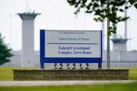 FILE - This Aug. 28, 2020, file photo shows the federal prison complex in Terre Haute, Ind. Corey Johnson, A federal inmate scheduled to be executed less than a week before President Donald Trump leaves office was a gang member who was sentenced to death for killing seven people in Richmond, Virginia in 1992. Johnson is scheduled to be executed Thursday, Jan. 14, 2021, at the federal prison in Terre Haute. (AP Photo/Michael Conroy, File)