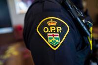 An Ontario Provincial Police crest is displayed on the arm of an officer during a press conference in Vaughan, Ont., on Thursday, June 20, 2019.