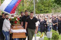 Relatives of a victim carry a coffin during a funeral for five people killed during the second mass shooting in two days, in the village of Malo Orasje, some 50 kilometers (30 miles) south of Belgrade, Serbia, Saturday, May 6, 2023. In Thursday's attack, a 20-year-old gunman apparently firing at random killed eight people and wounded 14 in two Serbian villages. (AP Photo/Darko Vojinovic)