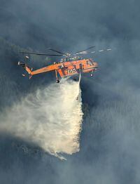 Rotary-wing aircraft is being used regularly on the Horsethief Complex of fires near Invermere, B.C. as shown in this undated handout image. THE CANADIAN PRESS/HO, BC Wildfire Service *MANDATORY CREDIT*