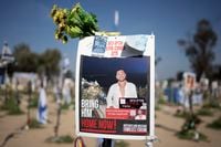 A poster depicting Israeli hostage Eliya Cohen is displayed at a memorial on the Nova music festival where he was kidnapped to Gaza by Hamas on Oct. 7, 2023 in Re'im, southern Israel near the Gaza border, Monday, Feb. 26, 2024. (AP Photo/Maya Alleruzzo)