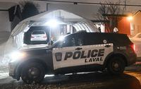 Police are shown outside the home of Pierre Ny St-Amand in Laval, Que, Wednesday, February 8, 2023. St-Amand is charged after a city bus was driven into a daycare centre leaving two children dead. He has been ordered by a judge to undergo a psychiatric evaluation. THE CANADIAN PRESS/Graham Hughes