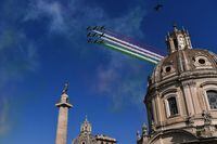 Aermacchi MB-339 aircrafts of the Italian Air Force aerobatic unit "Frecce Tricolori" (Tricolor Arrows) spread smoke with the colors of the Italian flag over Trajan's Forum (Foro Traiano) and Piazza Venezia in Rome to mark the 77th Repubblic Day on June 2, 2023. (Photo by Laurent EMMANUEL and LAURENT EMMANUEL / AFP) (Photo by LAURENT EMMANUEL/AFP via Getty Images)