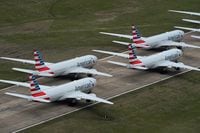 FILE PHOTO: American Airlines passenger planes crowd a runway where they are parked due to flight reductions to slow the spread of coronavirus disease (COVID-19), at Tulsa International Airport in Tulsa, Oklahoma, U.S. March 23, 2020. REUTERS/Nick Oxford/File Photo