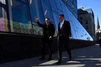 Conservative MP and leadership candidate Pierre Poilievre walks with his caucus colleague Andrew Scheer, a former leader of the party, as they arrive for a press conference outside the Bank of Canada in Ottawa, on Thursday, April 28, 2022. Poilievre is tapping Scheer to serve as his chief lieutenant in the House of Commons, as the newly minted Conservative leader prepares his party for next week's return of Parliament. THE CANADIAN PRESS/Justin Tang
