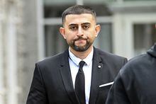 FILE - Nauman Hussain, who ran the limousine company involved in the 2018 crash that killed 20 people, walks outside during a lunch break in a new trial in Schoharie, N.Y., May 1, 2023. A jury found Hussain, the operator of a limousine service, guilty of second-degree manslaughter Wednesday, May 17, 2023, for a crash in rural New York that killed 20 people.(AP Photo/Hans Pennink, File)
