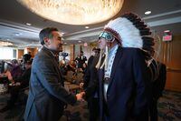 Chief Clinton Key, right, of the Key First Nation, is greeted by Liberal MLA Michael Lee, critic for Indigenous Relations and Reconciliation, after a news conference in Vancouver, on Tuesday, March 21, 2023. Leaders of Saskatchewan's Key First Nation say they held a "productive discussion" with senior officials from British Columbia and have agreed to keep talking about critical outstanding issues. THE CANADIAN PRESS/Darryl Dyck