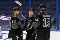 Tampa Bay Lightning center Yanni Gourde (37) celebrates his goal against the Chicago Blackhawks with center Blake Coleman (20) and right wing Barclay Goodrow (19) during the second period of an NHL hockey game Saturday, March 20, 2021, in Tampa, Fla. (AP Photo/Chris O'Meara)