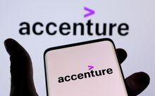 FILE PHOTO: Accenture PLC logo is seen on a smartphone in front of displayed same logo in this illustration taken, December 1, 2021. REUTERS/Dado Ruvic/Illustration