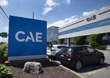 The new CAE logo is seen in front of the flight and simulation company’s plant, Thursday, July 21, 2022 in Montreal. THE CANADIAN PRESS/Ryan Remiorz